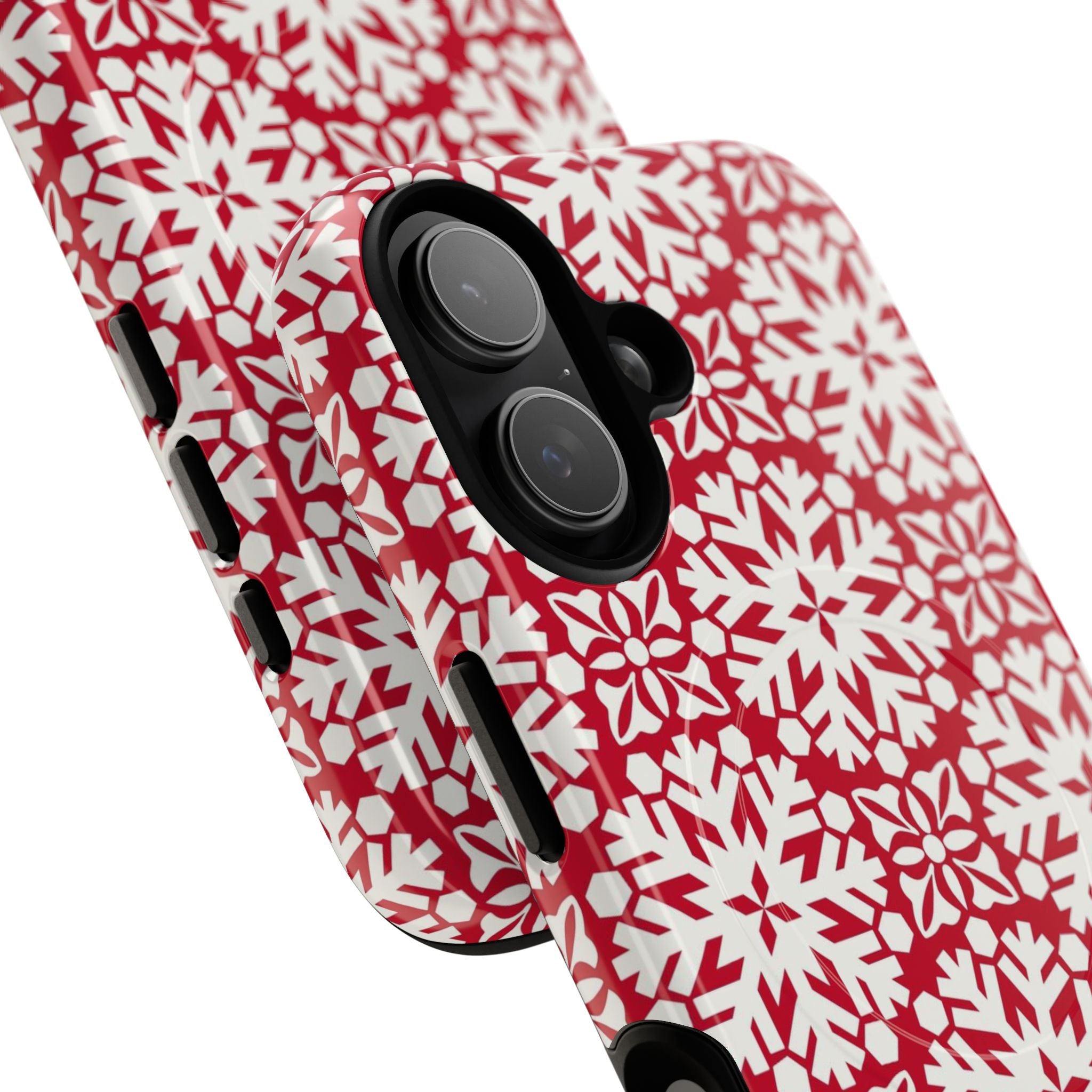 Flurry MagSafe iPhone 17 Case – Glossy | angled view closeup of camera cutout and buttons | red and cream geometric snowflake tile print