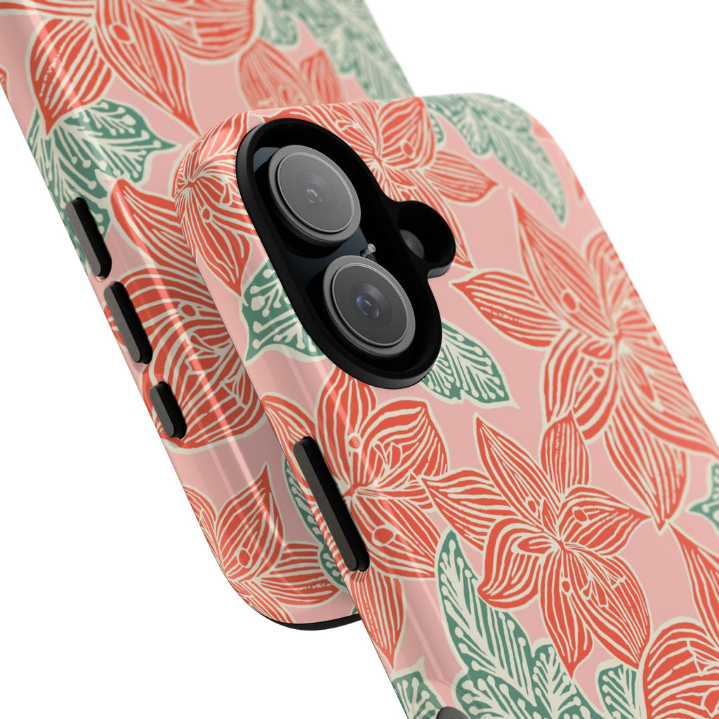 Hibiscus Coral iPhone 17 Glossy Case — angled view showing slim profile; blush pink case with coral red hibiscus flowers and teal-green leaves in bold botanical linework