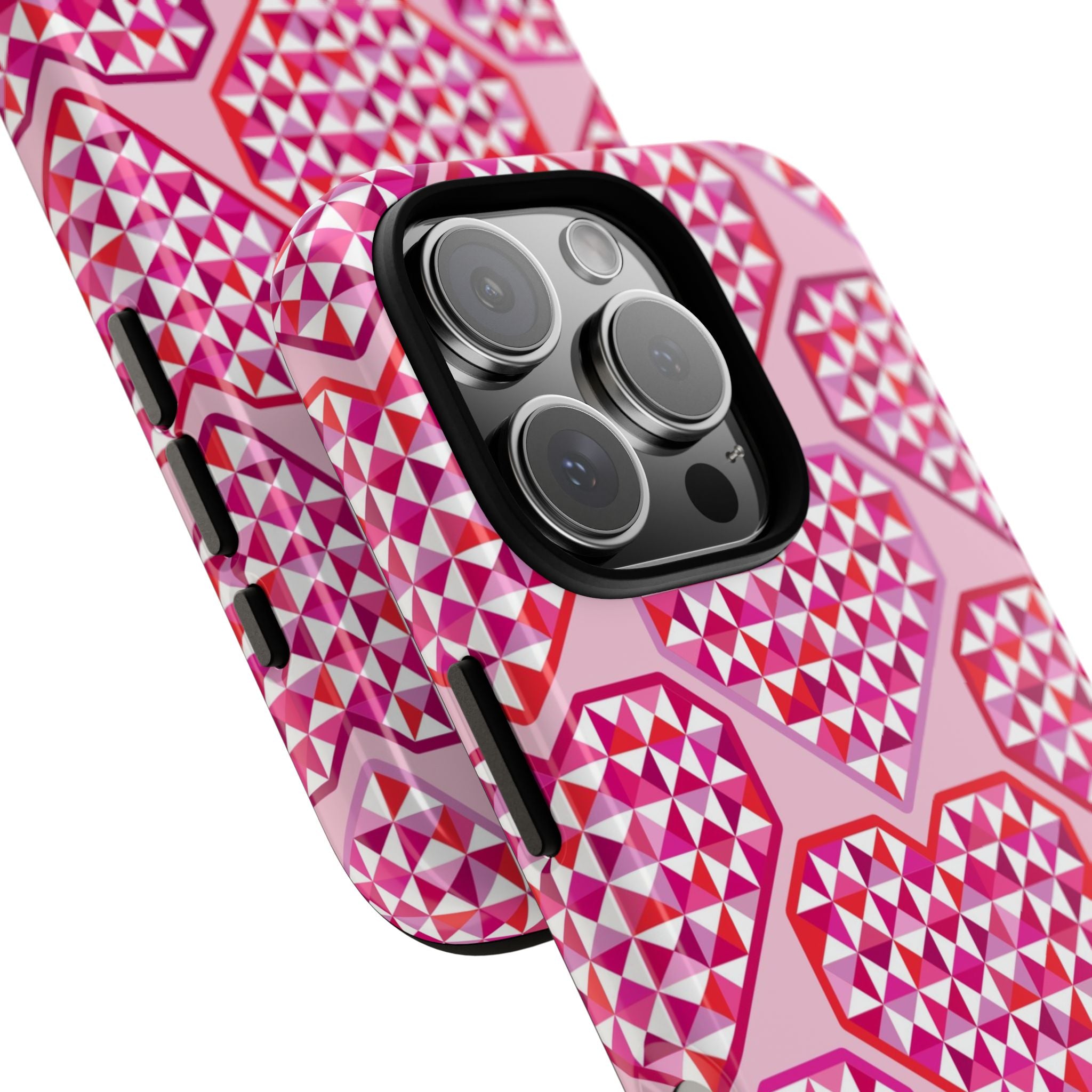 Pink Pyramid Heart Tough iPhone 16 Pro Max Case – lifestyle angled view | blush, pink, magenta, red geometric pyramid heart print