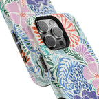Tropica MagSafe iPhone 16 Pro Max Case – Glossy angled view closeup of camera cutout and buttons | purple, coral, pink, blue botanical tropical floral print MagSafe compatible, dual-layer protection