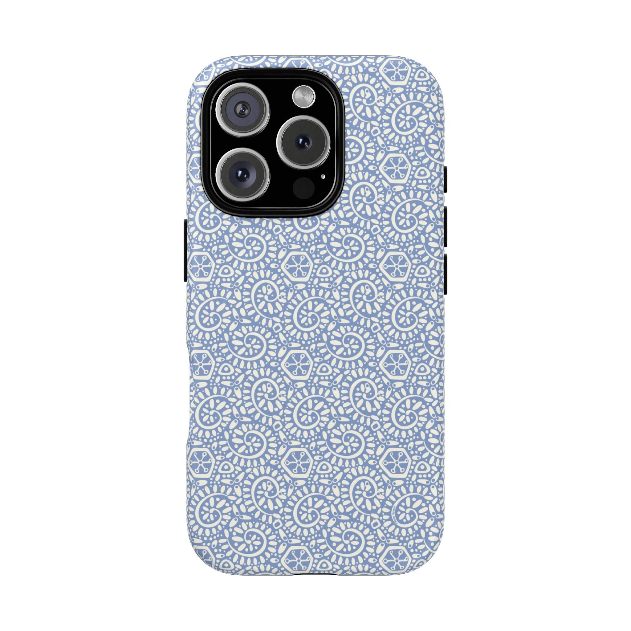Canto Swirls Mist MagSafe iPhone 16 Pro Matte Case — periwinkle blue hard case covered in an intricate folk-art medallion pattern of radiating white circular motifs, dot clusters, and geometric centers