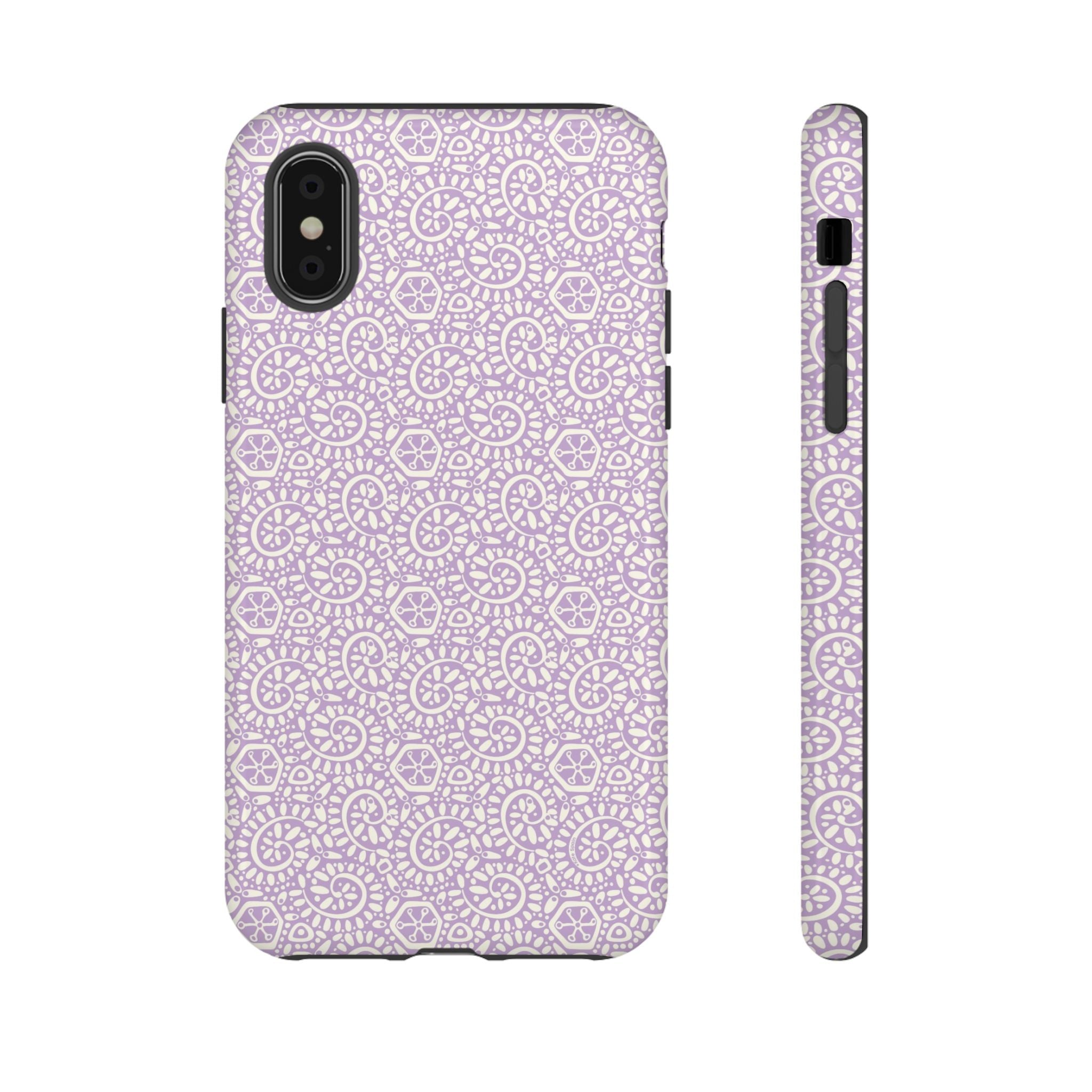 Canto Swirls Lavender iPhone X Glossy Case — lavender hard case covered in an intricate folk-art medallion pattern of radiating circular motifs, dot clusters, and geometric centers
