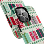 All Wrapped Up Tough iPhone 16 Pro Max Case – lifestyle angled view | cream, red, pink, green, mint geometric gift wrap holiday print
