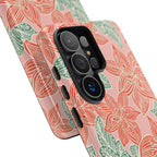 Hibiscus Coral Samsung Galaxy S26 Ultra Glossy Case — dual-layer construction detail showing ports, camera cutout, and buttons; coral red hibiscus and teal-green leaves botanical print