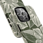Vintage Bloom Cypress MagSafe iPhone 16 Pro Max – Glossy | cypress green ground, large-scale white clematis print, angled view showing camera cutout and buttons, dual-layer protection