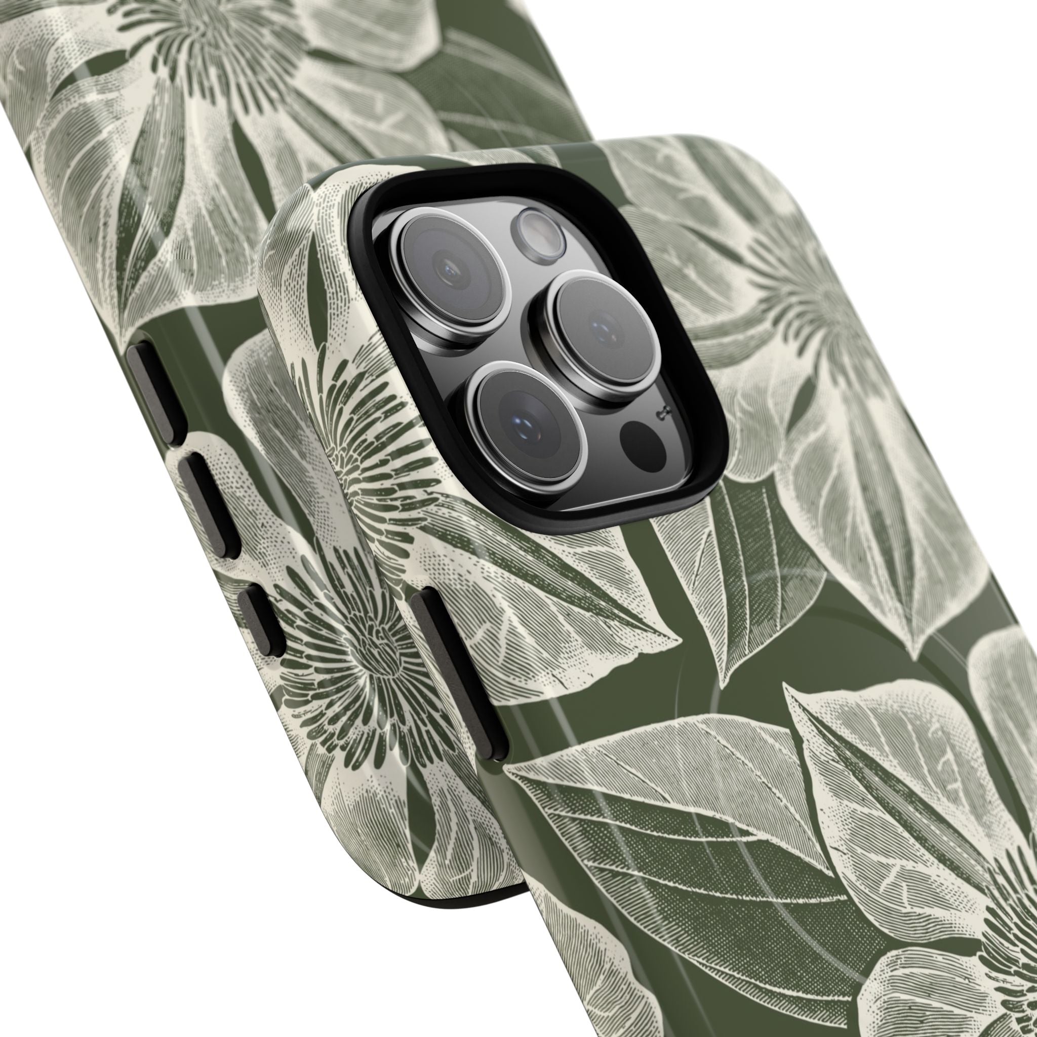 Vintage Bloom Cypress MagSafe iPhone 16 Pro Max – Glossy | cypress green ground, large-scale white clematis print, angled view showing camera cutout and buttons, dual-layer protection