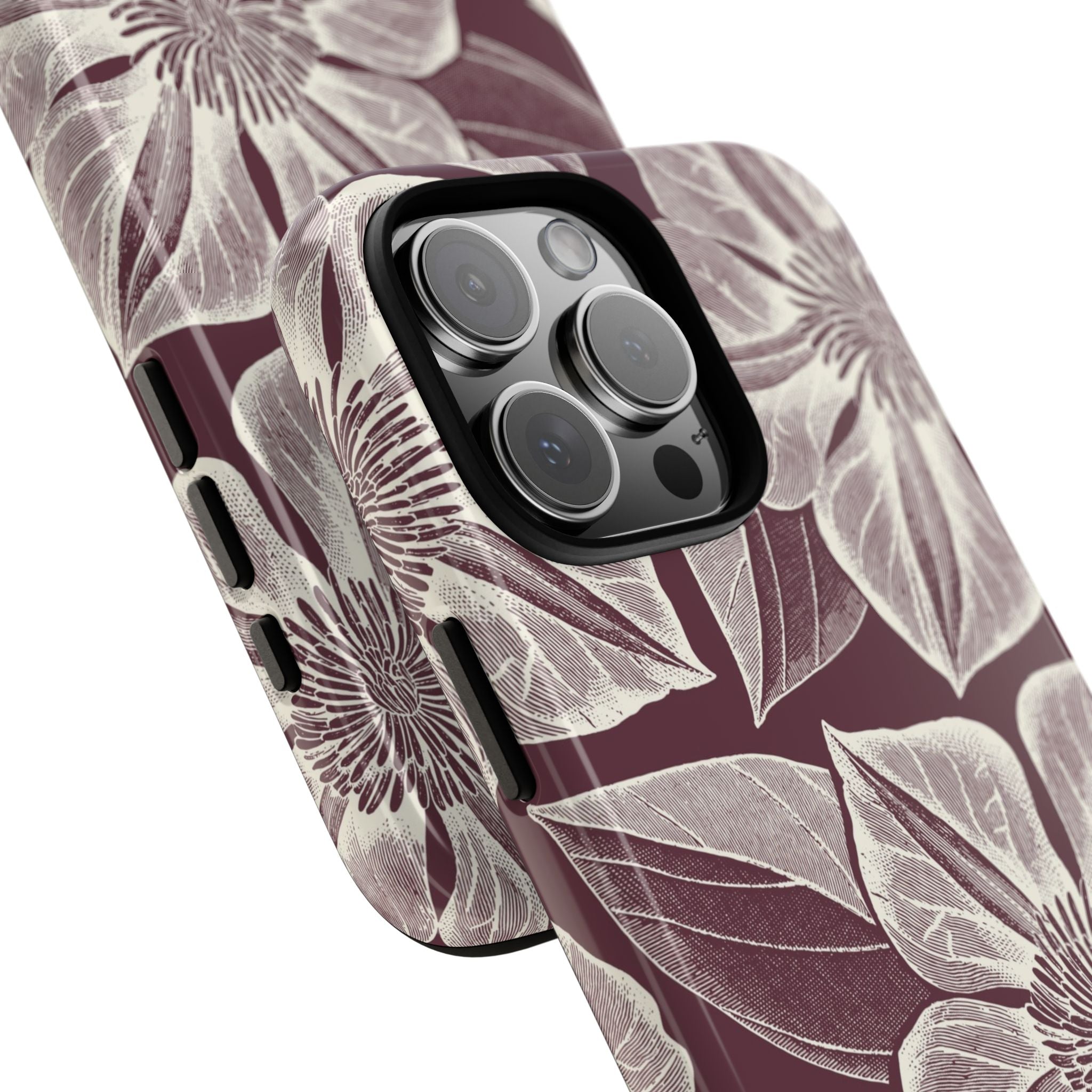 Vintage Bloom Burgundy iPhone 16 Pro Max case – Glossy | burgundy ground, large-scale cream clematis print, angled view showing camera cutout and buttons, dual-layer protection
