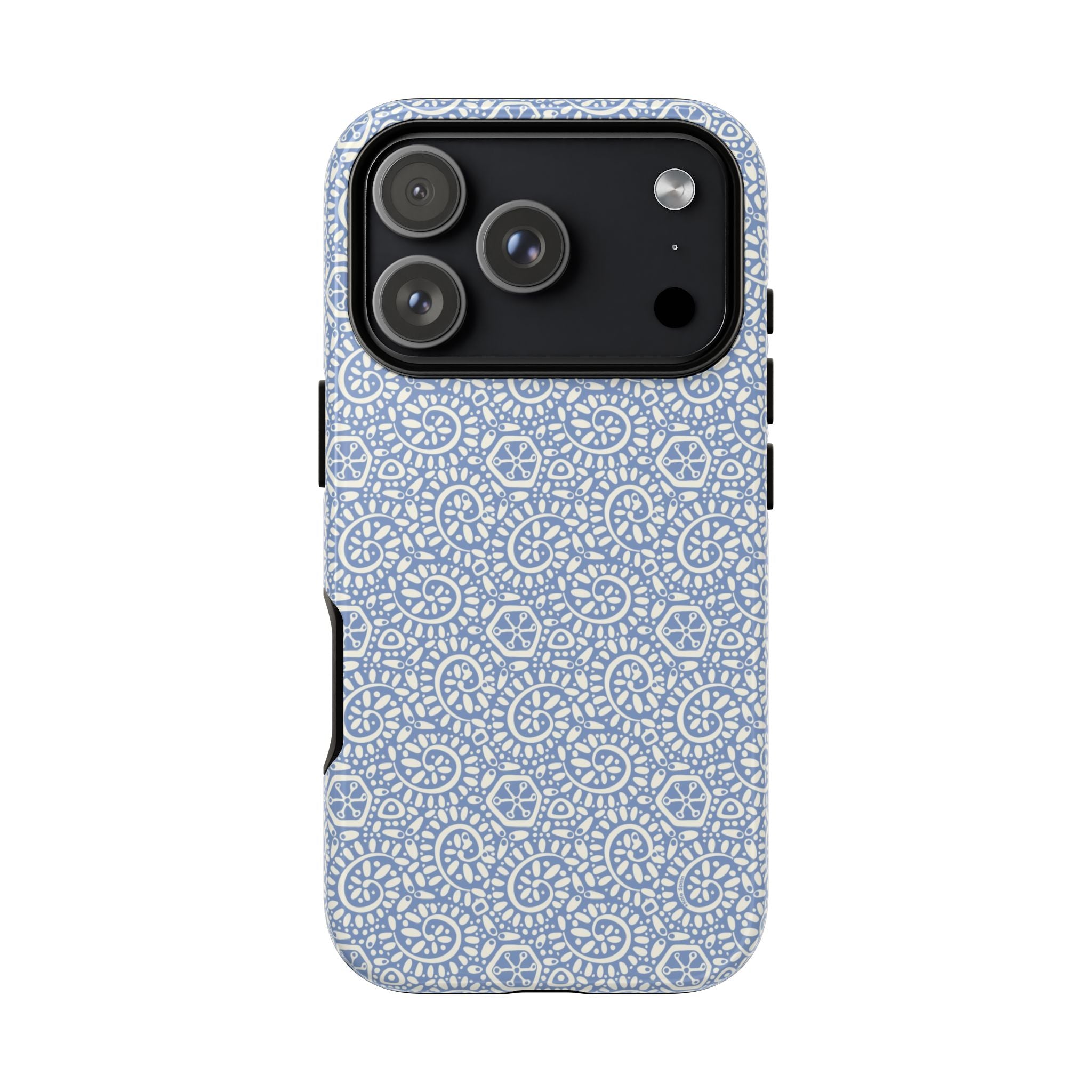 Canto Swirls Mist iPhone 17 Air Matte Case — periwinkle blue hard case covered in an intricate folk-art medallion pattern of radiating white circular motifs, dot clusters, and geometric centers