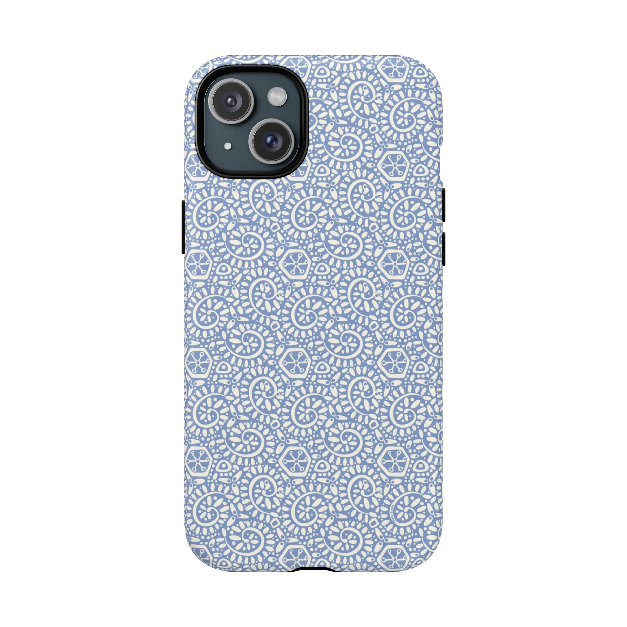 Canto Swirls Mist MagSafe iPhone 15 Plus Matte Case — periwinkle blue hard case covered in an intricate folk-art medallion pattern of radiating white circular motifs, dot clusters, and geometric centers