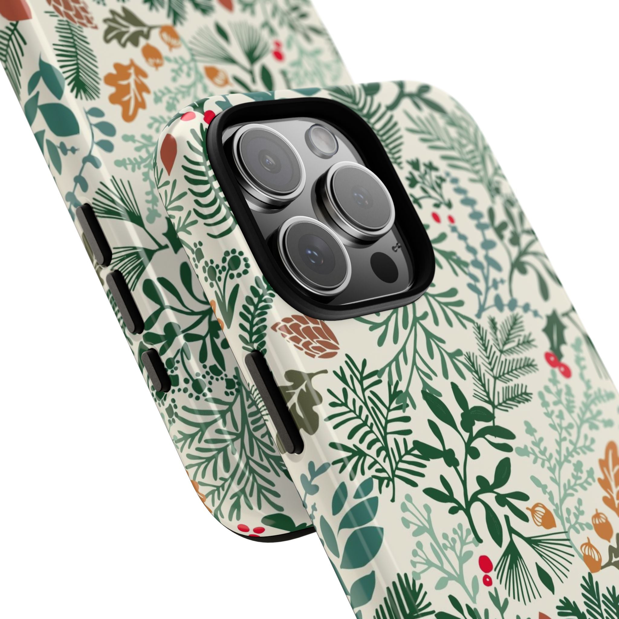 Juniper Tough iPhone 16 Pro Max Case – lifestyle/angled shot | cream, green, red botanical woodland print