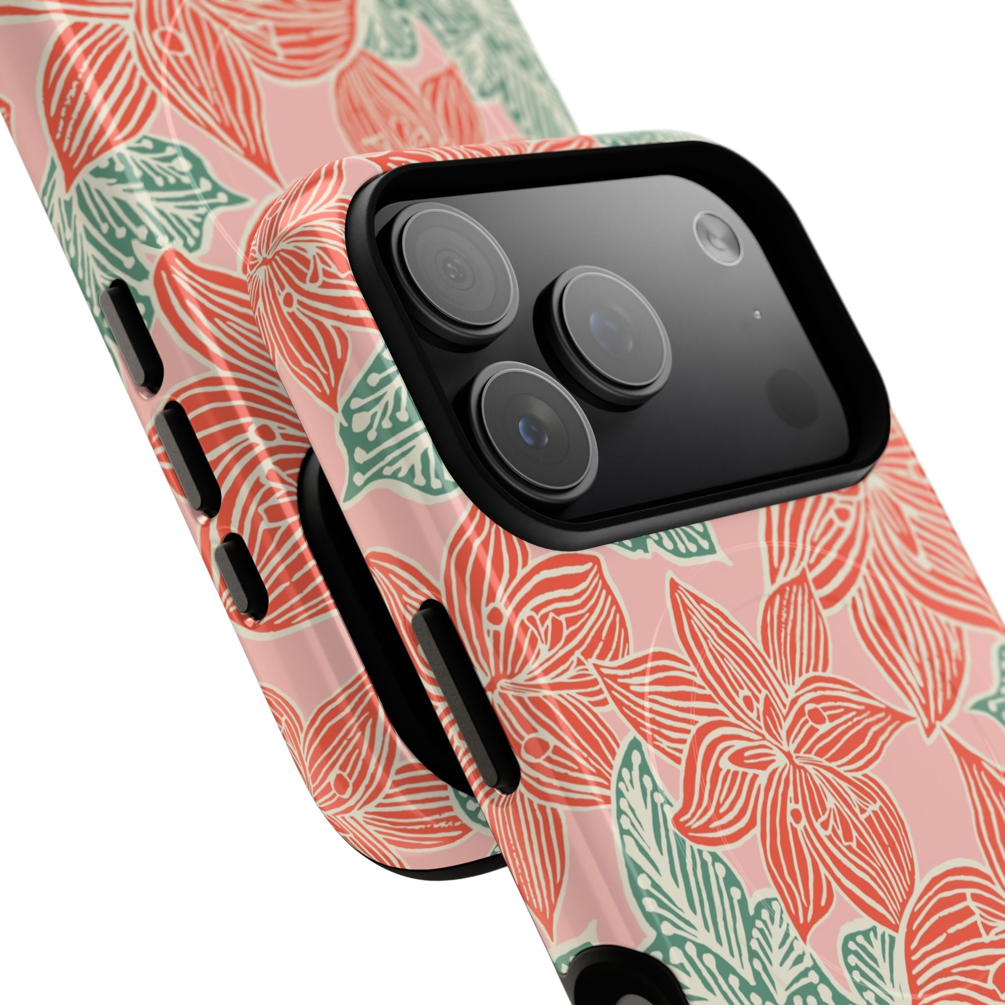 Hibiscus Coral MagSafe iPhone 17 Pro Max Glossy Case — angled view showing slim profile; blush pink case with coral red hibiscus flowers and teal-green leaves in bold botanical linework
