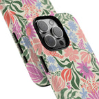 Botanica Pastel Tough iPhone 16 Pro Max Case – lifestyle angled shot | blush, lavender, sage pastel botanical wildflower print