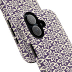 Lily Plum iPhone 17 Case – Glossy | angled view showing camera cutout and buttons — botanical phone case by Kate Spain