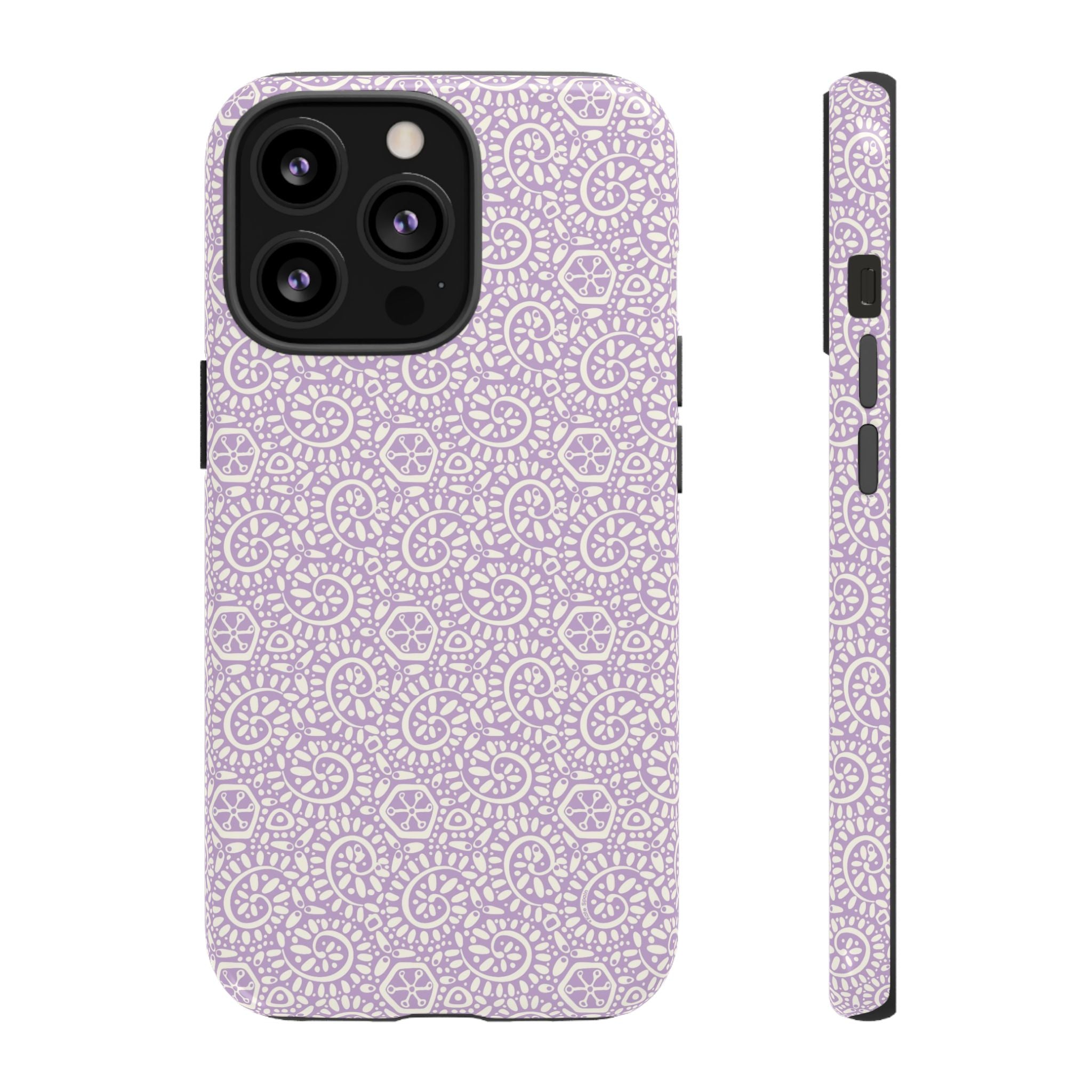 Canto Swirls Lavender iPhone 13 Pro Glossy Case — lavender hard case covered in an intricate folk-art medallion pattern of radiating circular motifs, dot clusters, and geometric centers