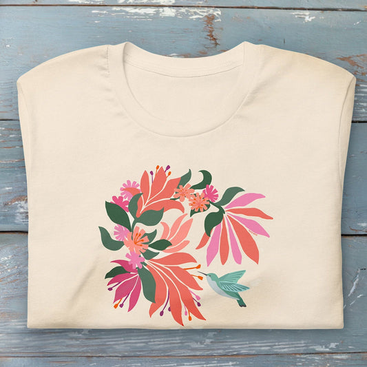 Folded off-white cream colored premium crewneck tshirt with large tropical flower design and small hummingbird graphic.