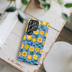 Luxury Sunflowers Samsung Galaxy S25 Ultra Case – Glossy | lifestyle photo of case in blue, yellow, gold geometric sunflower print
