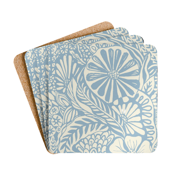 Set of floral patterned coasters with cork backing on a white background