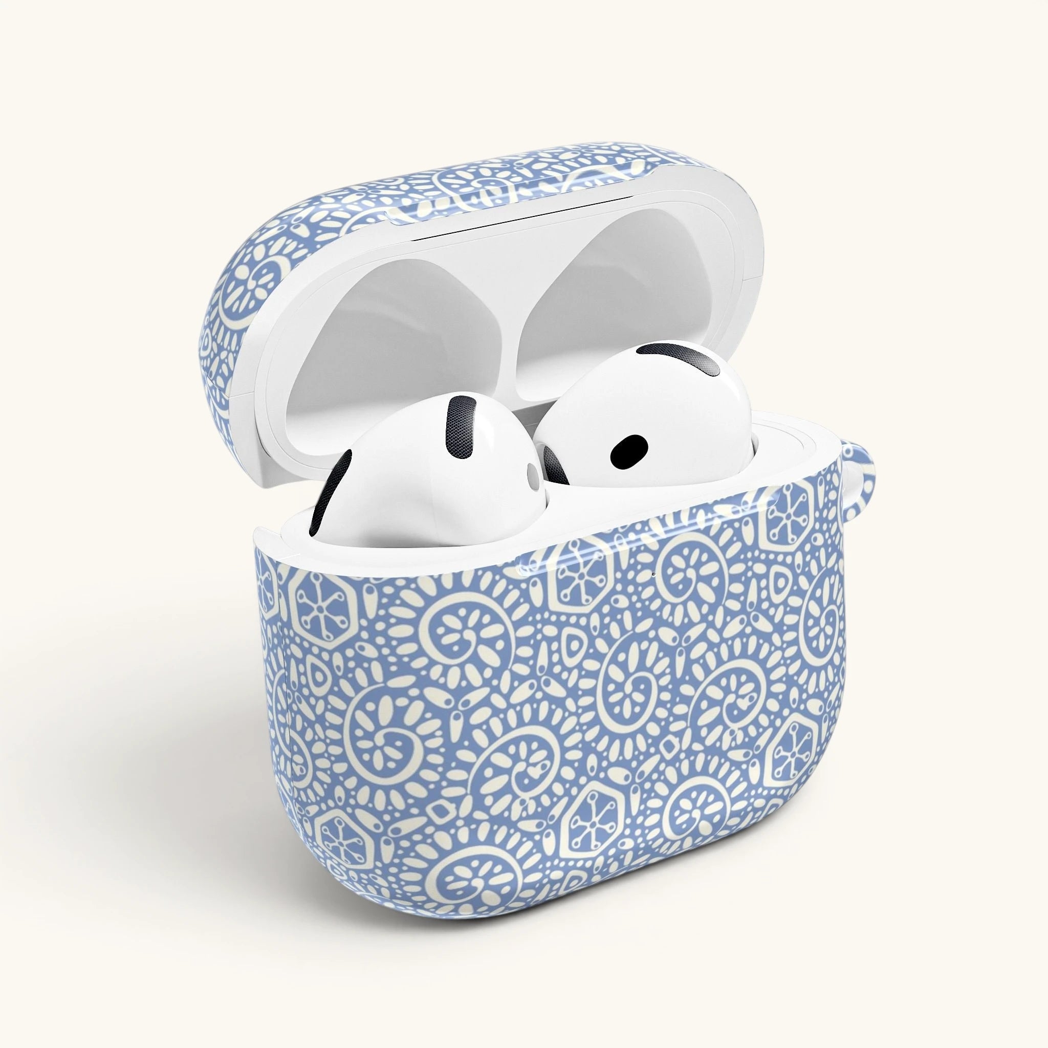 AirPods Gen 4 case showing opening for lid hinge – Glossy | soft white swirl and medallion pattern on pastel blue ground