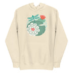 Illustrated dragonfly hovering over a green lily pad with pink and white water lily flowers on a rippled circular pond, printed on a soft premium off-white bone colored hoodie sweatshirt.