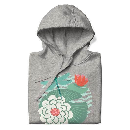 Illustrated dragonfly hovering over a green lily pad with pink and white water lily flowers on a rippled circular pond, printed on a soft premium athletic gray hoodie sweatshirt.