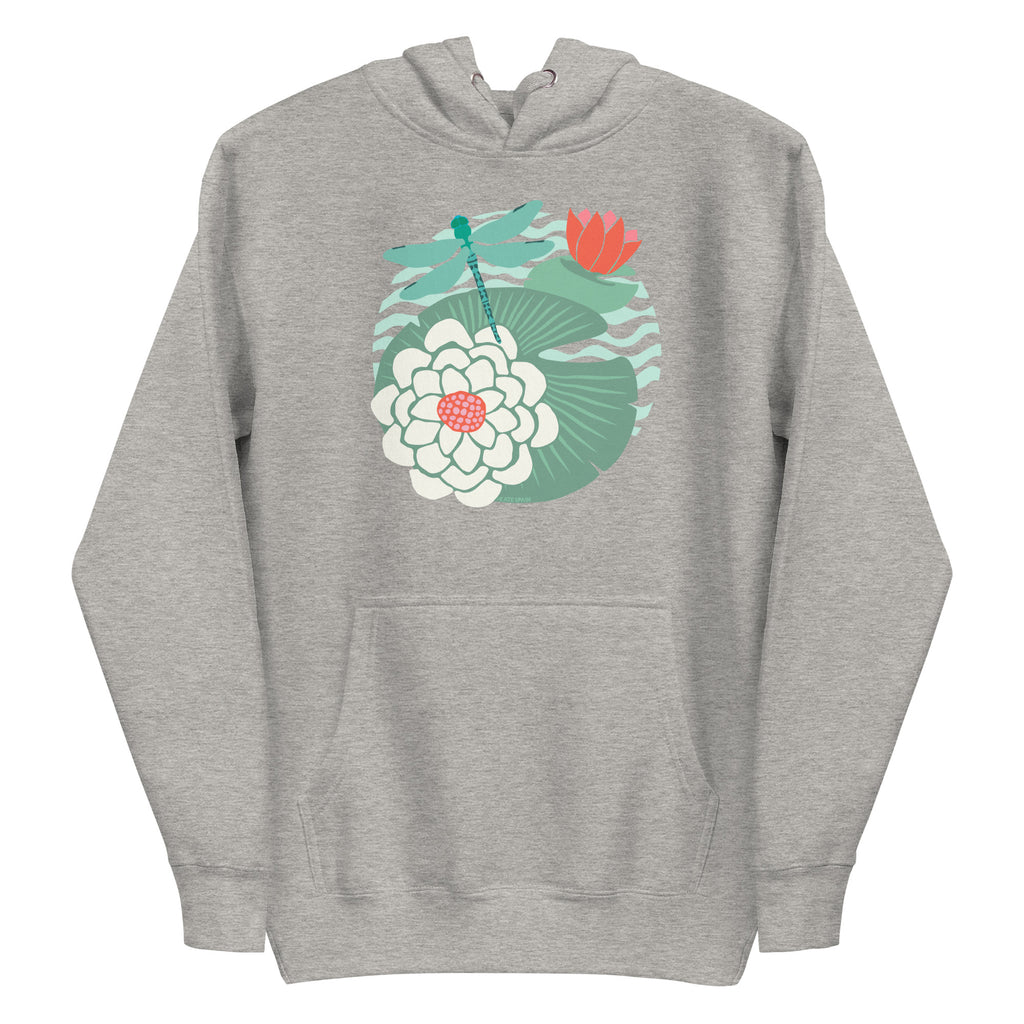 Illustrated dragonfly hovering over a green lily pad with pink and white water lily flowers on a rippled circular pond, printed on a soft premium athletic gray hoodie sweatshirt.