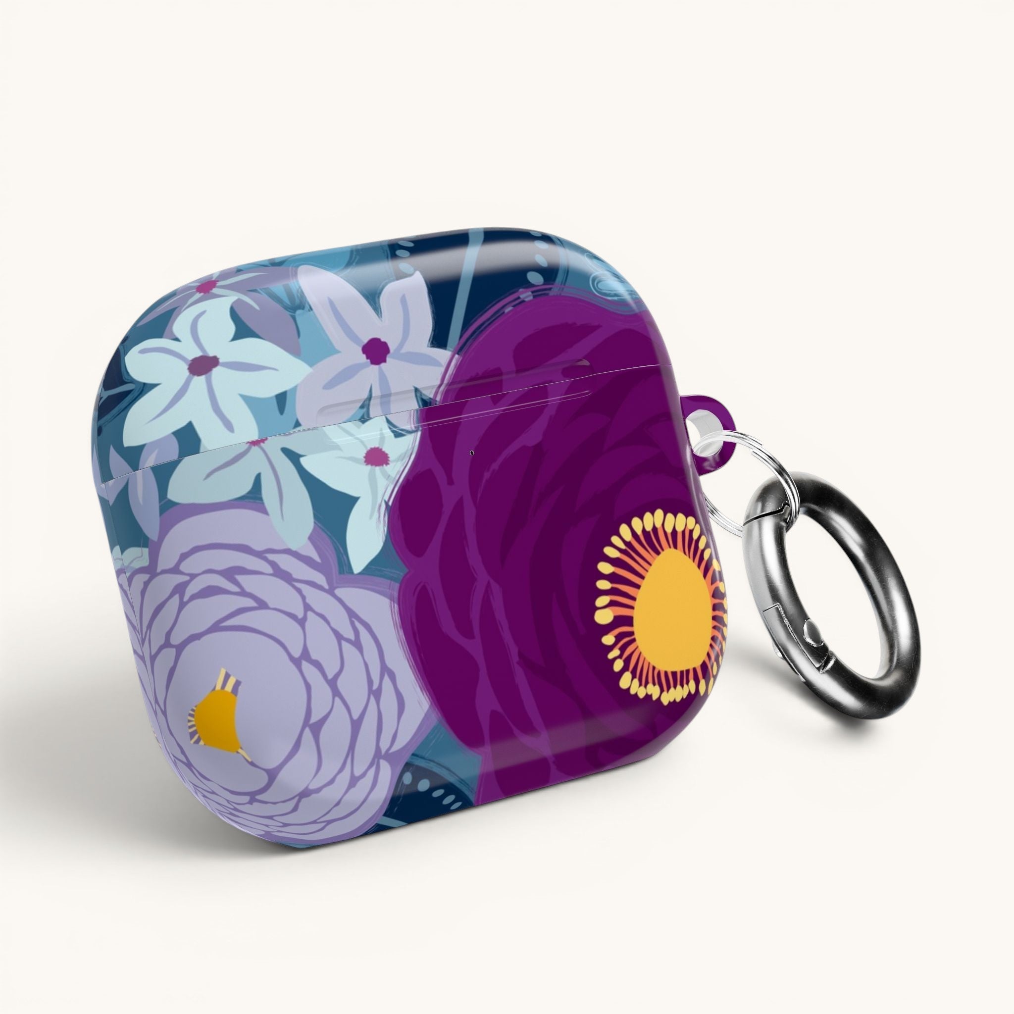 Floriori Bloomerie Violet AirPods Pro case with a floral print in deep violet, plum, and light blue. Features a glossy finish and carabiner clip.