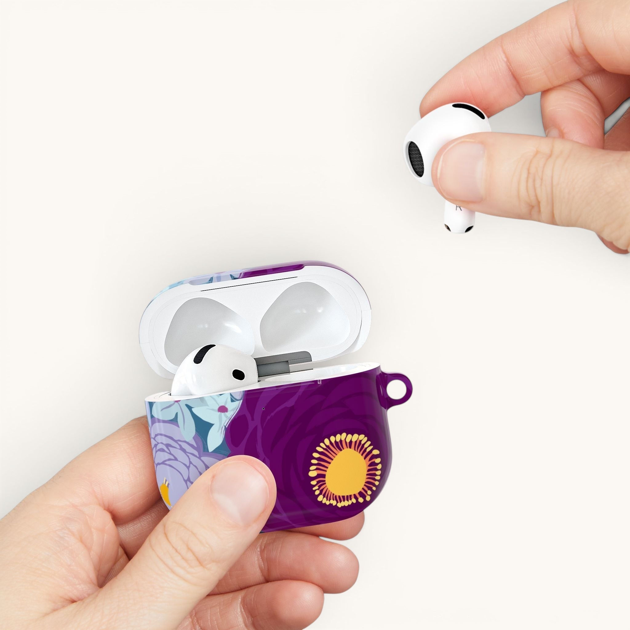 Floriori Bloomerie Violet AirPods Pro case with floral print, featuring deep violet and plum blooms. Includes carabiner.