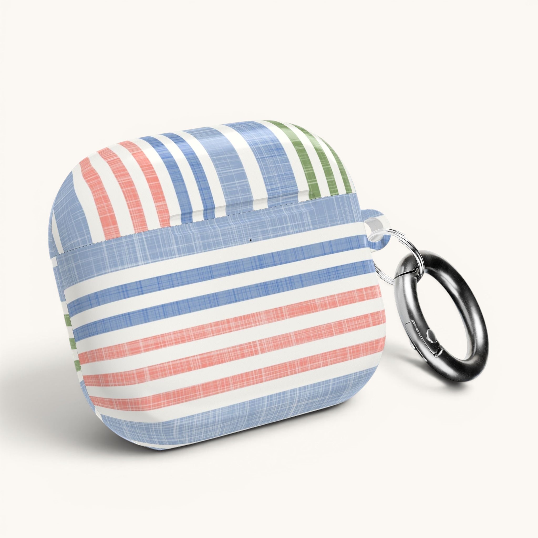 floriori Cabana Stripe Pastel AirPods Case with blue, coral, and sage green stripes and a chambray texture. Includes carabiner.