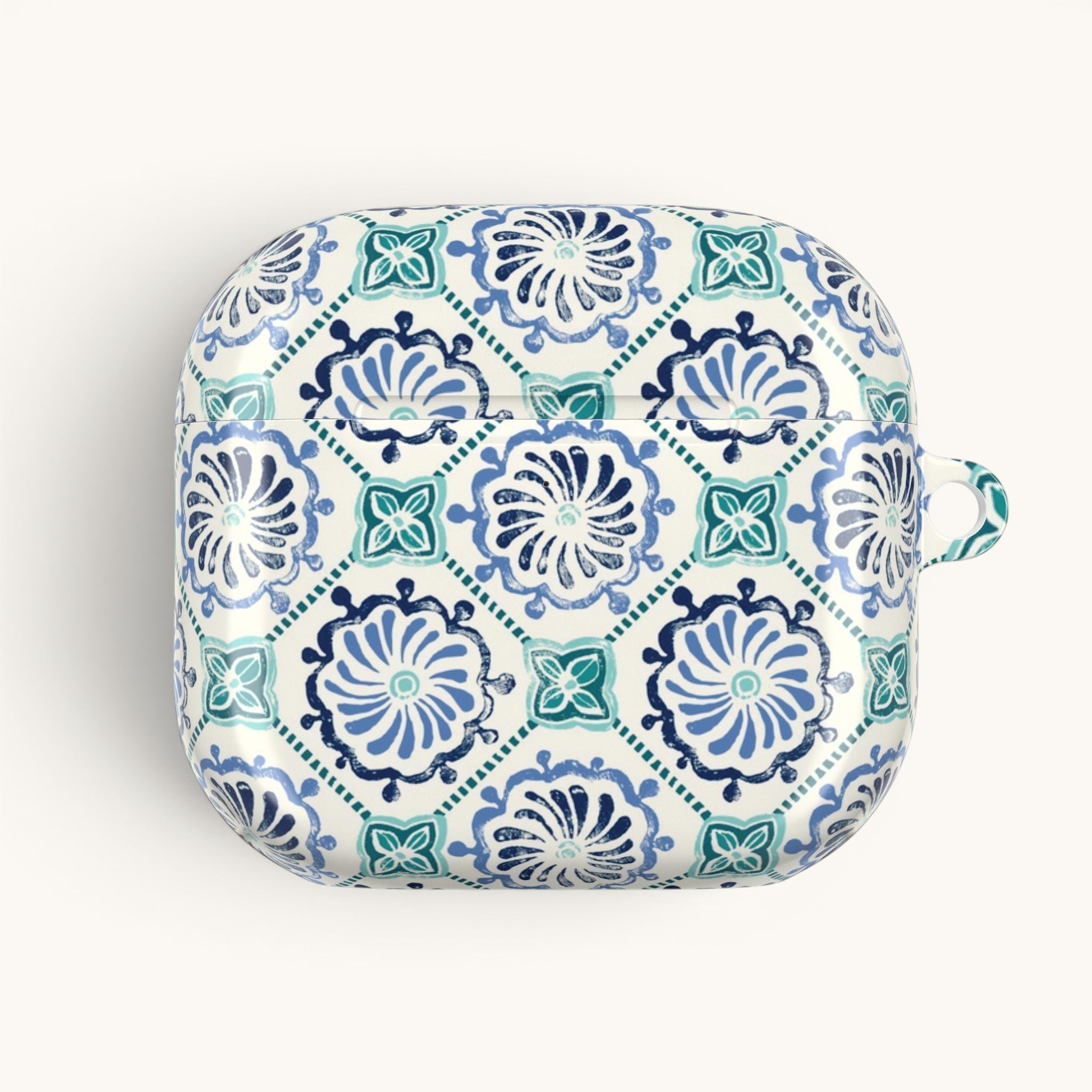 floriori Horizon Blue Tile AirPods case with a navy and teal Moroccan-inspired floral medallion print on white.