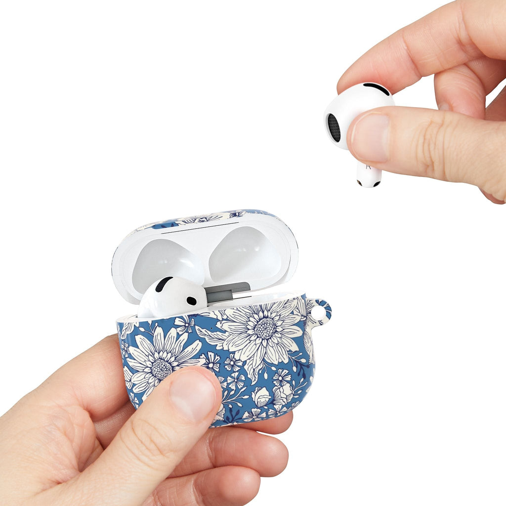 floriori Jardin Blue AirPods case featuring a white hand drawn botanical toile print on a deep blue glossy polycarbonate shell