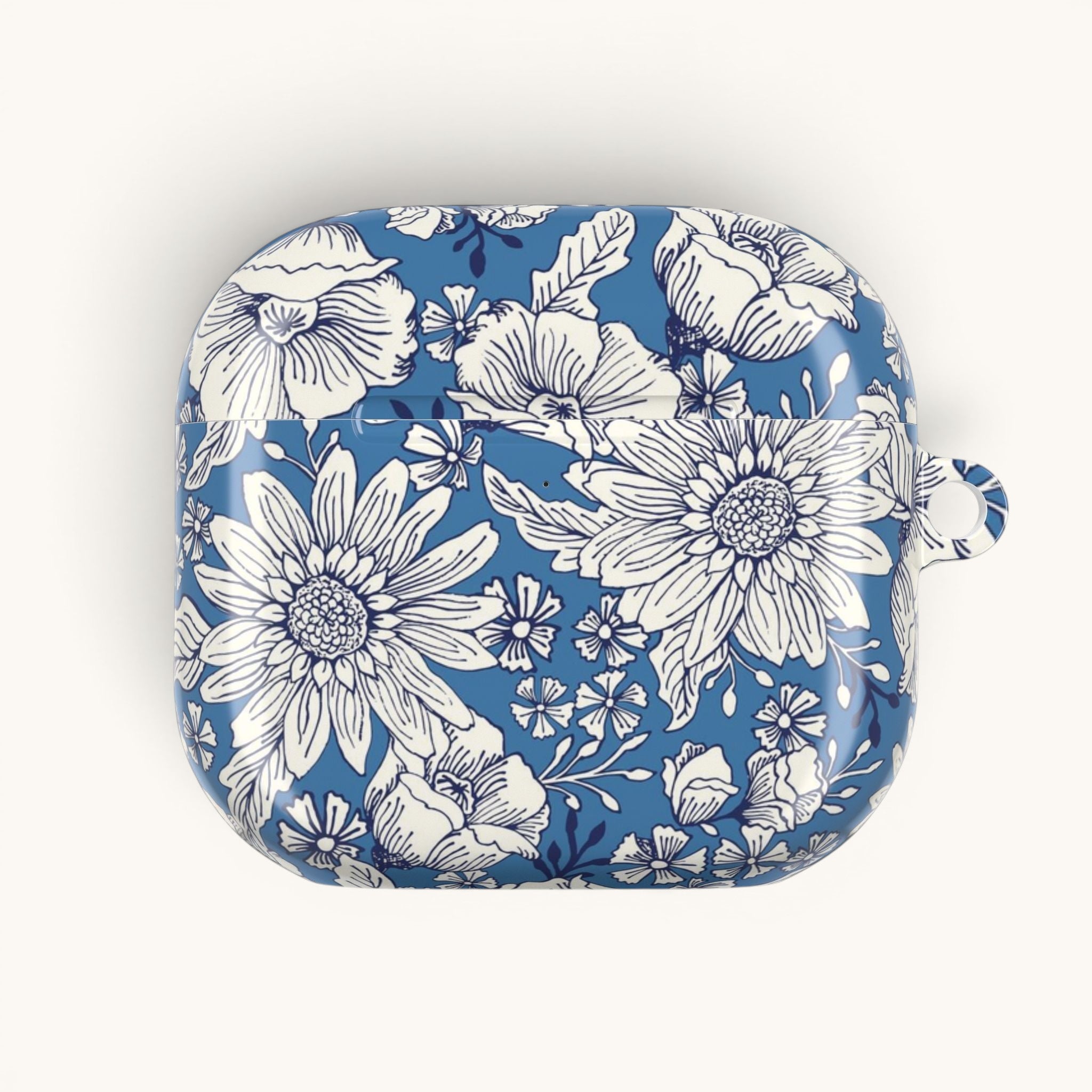 floriori Jardin Blue AirPods case featuring a white hand drawn botanical toile print on a deep blue glossy polycarbonate shell
