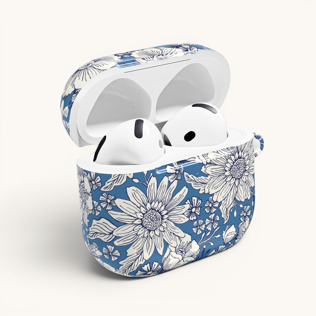 floriori Jardin Blue AirPods case featuring a white hand drawn botanical toile print on a deep blue glossy polycarbonate shell