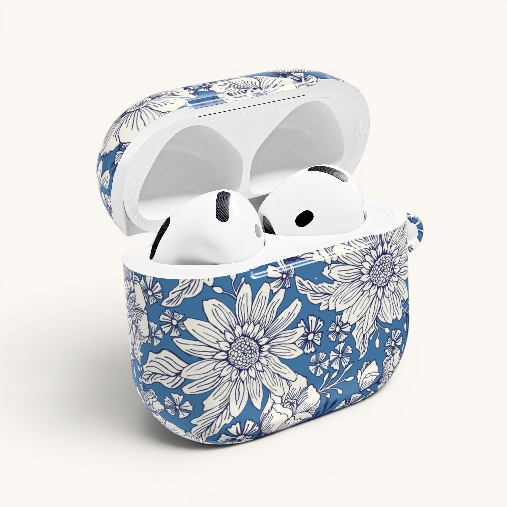 floriori Jardin Blue AirPods case featuring a white hand drawn botanical toile print on a deep blue glossy polycarbonate shell