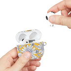 floriori Jardin Yellow AirPods case featuring a white hand drawn botanical toile print on a golden yellow glossy polycarbonate shell. Showing scale.