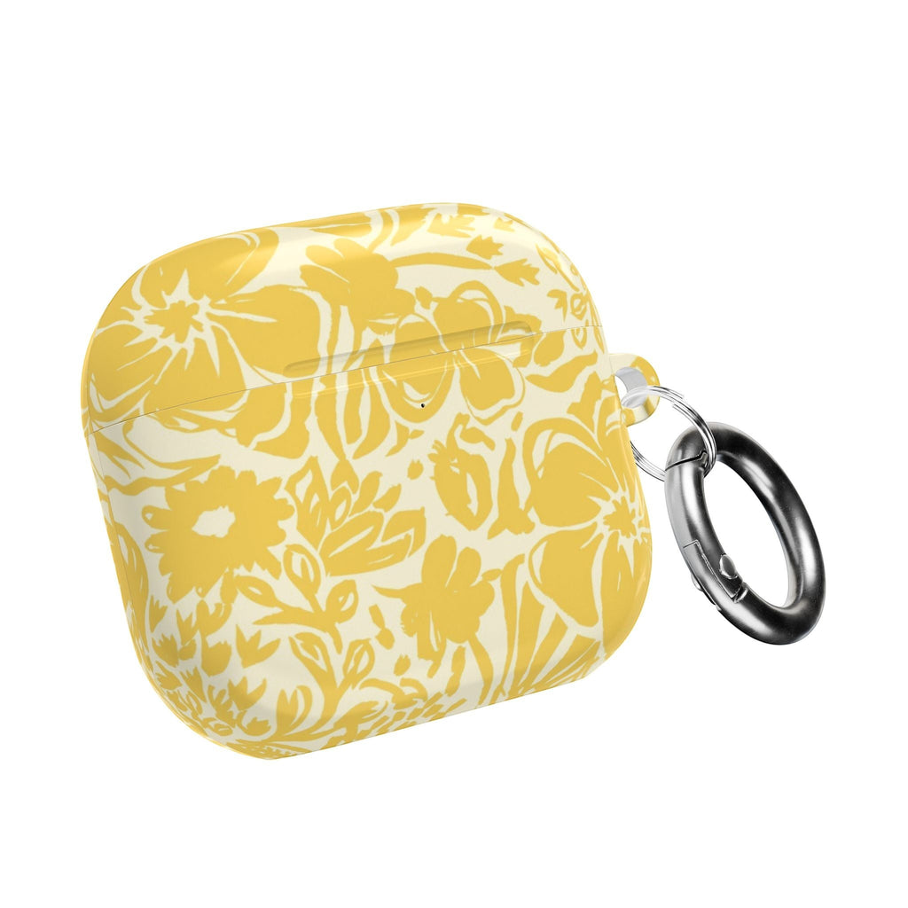 floriori AirPods case with sophisticated and energetic hand painted flower silhouettes. yellow floral on a cream glossy background. with caribener clip.