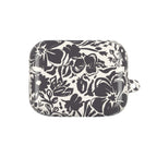 floriori AirPods Pro Gen 1 case with sophisticated and energetic hand painted flower silhouettes. black floral on a cream glossy background.