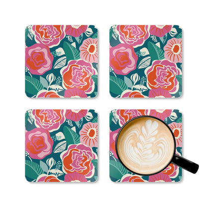 Set of four floral coasters with a cup of coffee on one coaster.