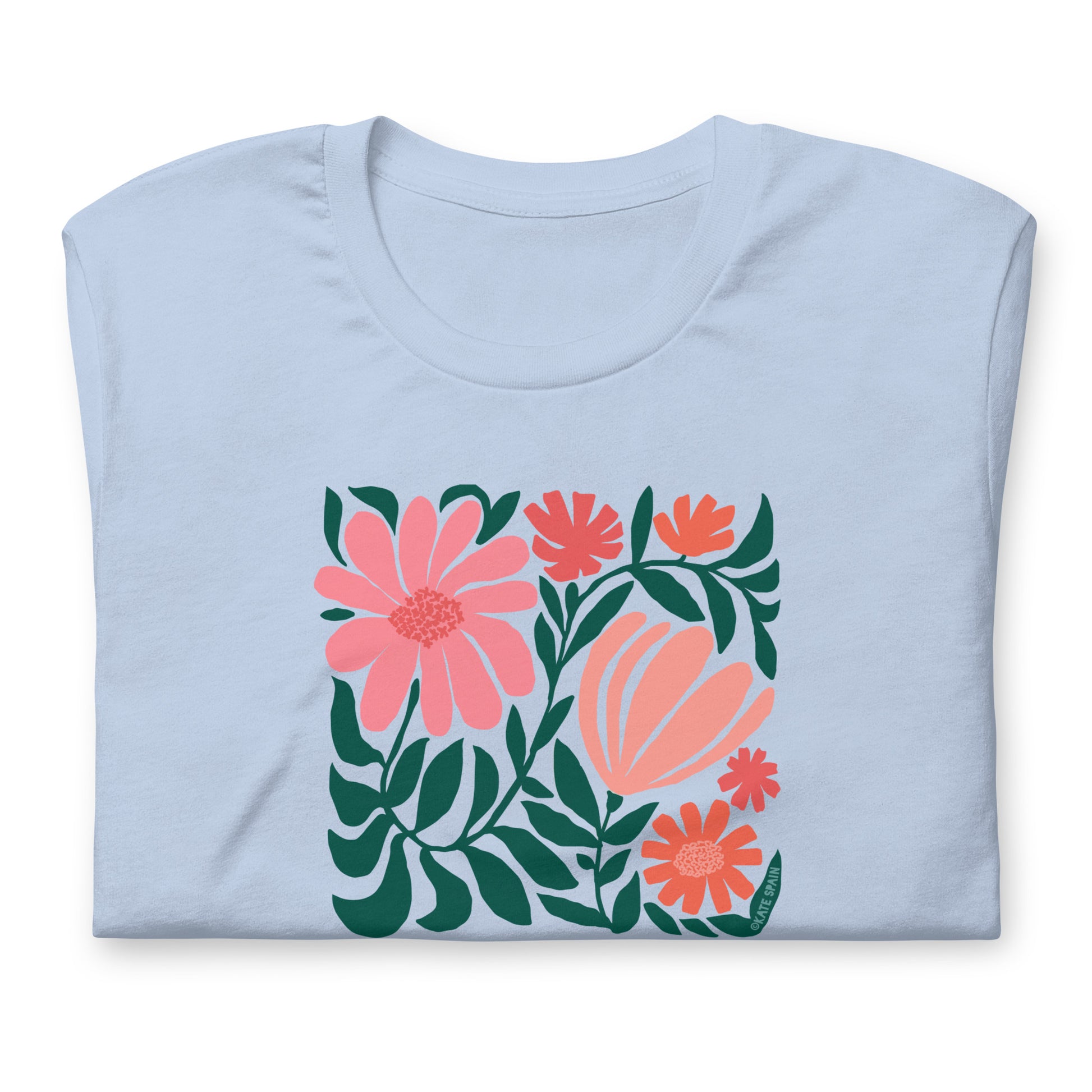 Minimalist floral graphic design with modern botanical illustrations printed on an pale baby blue colored premium crewneck tshirt. Shown folded for scale.