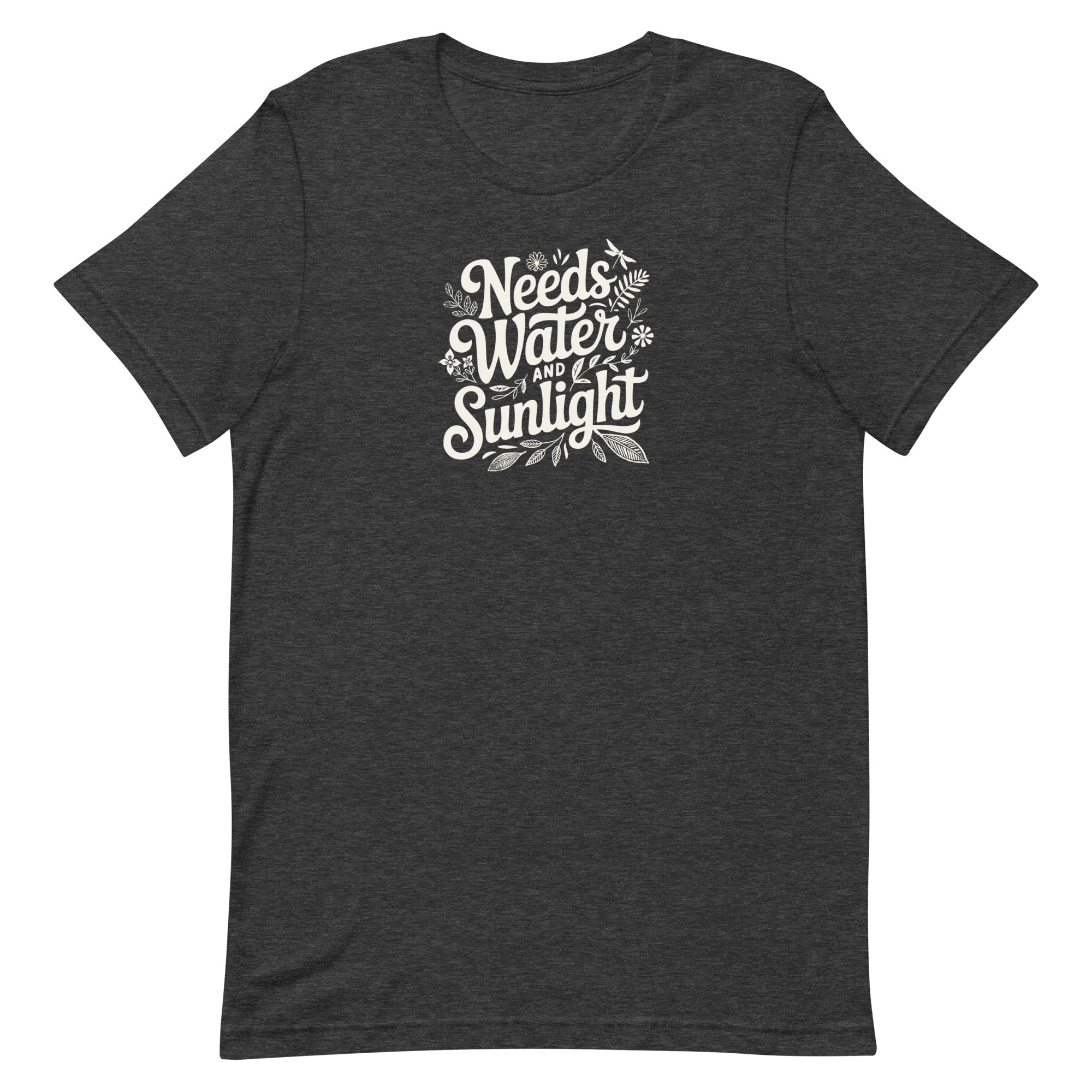 Dark charcoal gray heather colored crewneck t-shirt with white words that say 'Needs Water and Sunlight' in script style text with dragonfly, flower and leaf illustrations around the words.