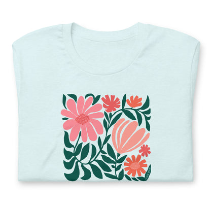 Minimalist floral graphic design with modern botanical illustrations printed on an pale ice blue colored premium crewneck tshirt. Shown folded for scale.