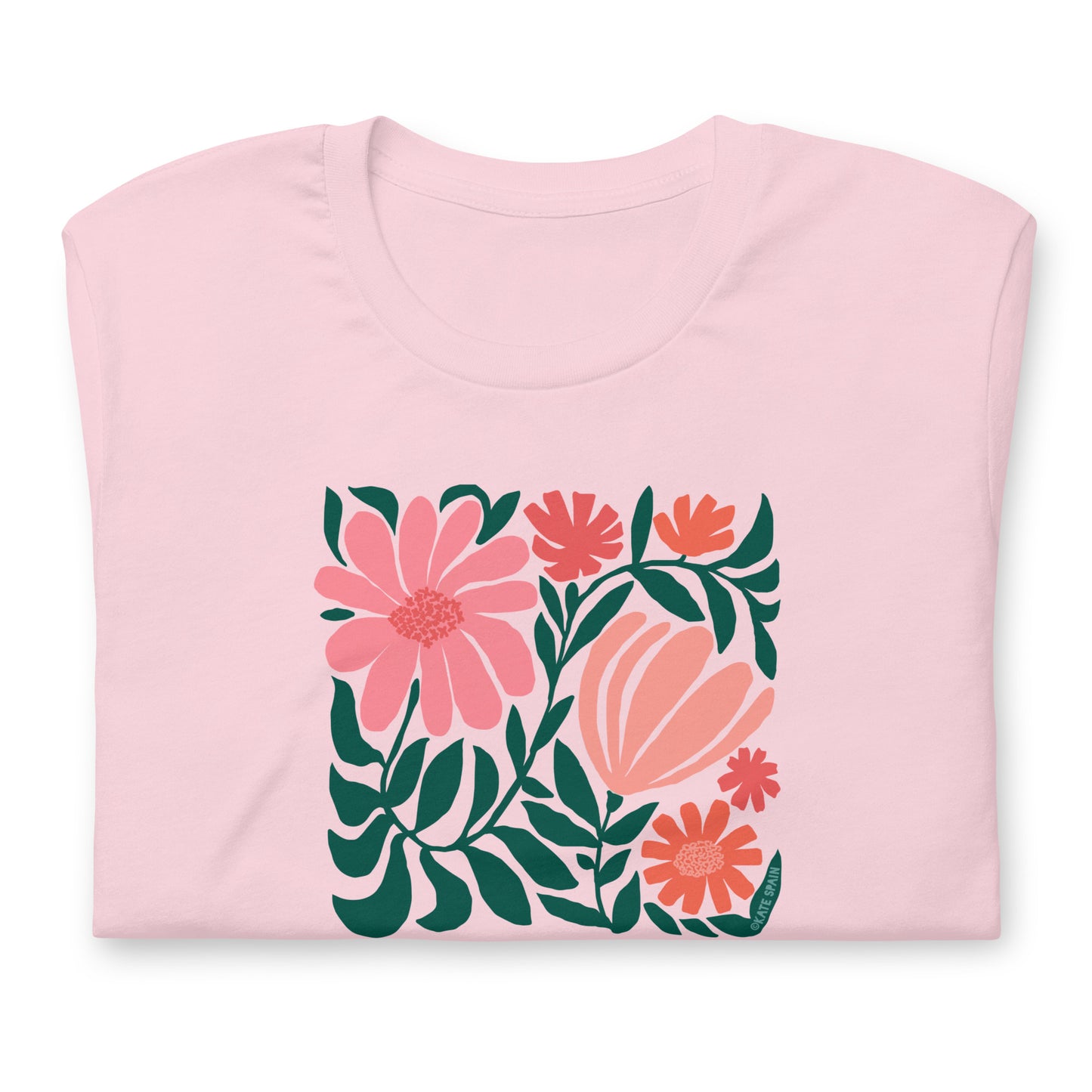 Minimalist floral graphic design with modern botanical illustrations printed on an pale soft pink colored premium crewneck tshirt. Shown folded for scale.