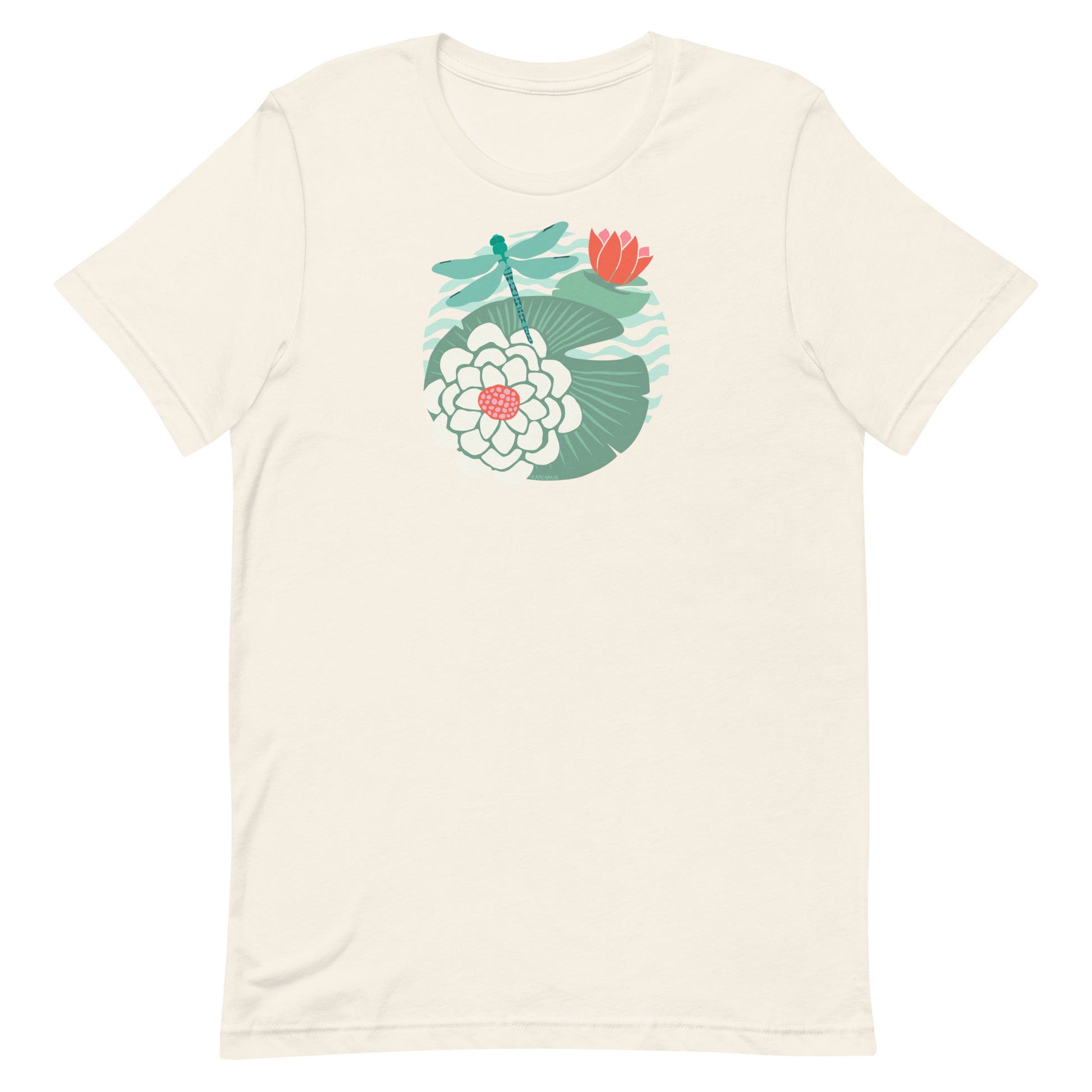 Illustrated dragonfly hovering over a green lily pad with pink and white water lily flowers on a calm pond, printed on a soft pale off-white cream colored premium quality crewneck t-shirt.